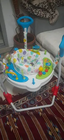 Baby activity jumper/doorway jumper with toys - Almost new