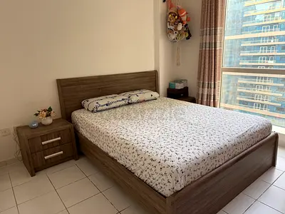 Queen-size wooden bed frame with mattress and bedside table - good condition