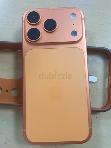 Used Apple iPhone (peach/orange) with case - good condition