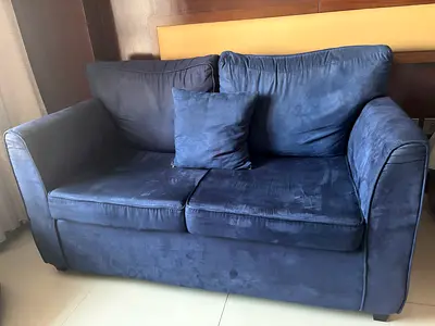 2-seater navy blue velvet sofa in good condition