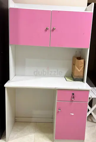 White and pink study desk with overhead cabinets and lockable drawer
