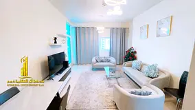 Furnished two-bedroom apartment for monthly rent in Ajman, including utilities, internet, and parkin