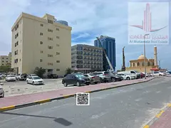 Residential/Commercial Land for Buildings on a paved road. Prime location near Ajman Corniche.