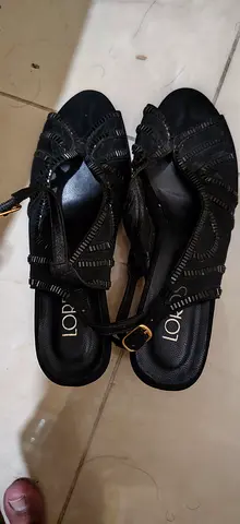 Black strappy low-heel sandals, size not marked, lightly used
