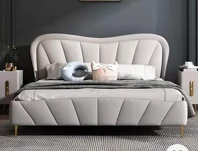 Modern upholstered queen bed with padded headboard and footboard