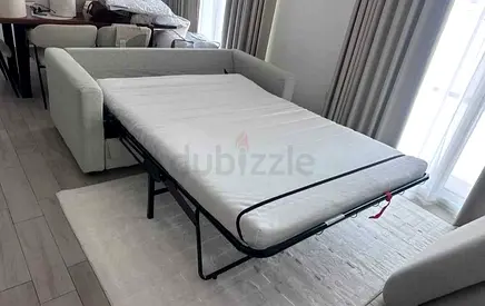 Light grey 2-seater sofa bed with mattress - excellent condition