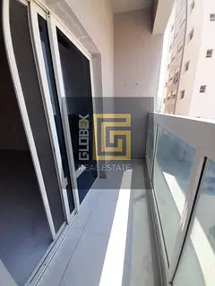 Spacious One-Bedroom Annual Rental Apartment in Al Jurf 3 with Balcony and Easy Access to Main Exits