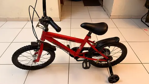 Kids red 16-inch bicycle with training wheels - used