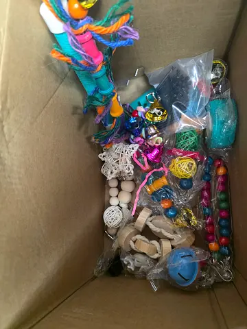 Box of assorted bird toys and perches – new / mixed lot