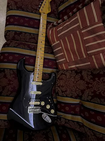 Black Stratocaster-style Electric Guitar with Maple Neck - Good Condition