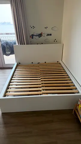 White wooden double bed frame with storage slats - good condition