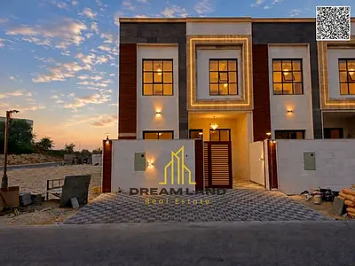 Villa for sale in Ajman, Al Zahia area, consisting of 4 master bedrooms, a majlis (formal sitting room), a living room, a maid's room, and a rooftop t