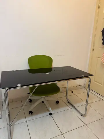 Compact black study desk with green office chair - Excellent