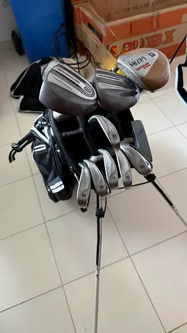 Complete golf club set with stand bag. Nike irons 5i-Sw, 5 wood, 3 wood, driver, putter.