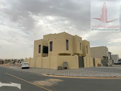 For sale in Ajman, a corner villa in Al Zahiyah, featuring 6 master bedrooms, 2 living rooms, 8 bathrooms, and a swimming pool. Asking 3.6M