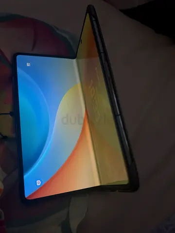 Foldable smartphone in good condition with protective case