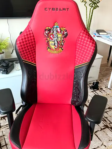 Red CYBERT gaming chair — ergonomic swivel chair with armrests