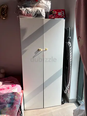 White single-door wardrobe/closet with shelves — good condition