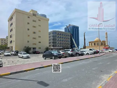 Residential/Commercial Land for Buildings on a paved road. Prime location near Ajman Corniche.