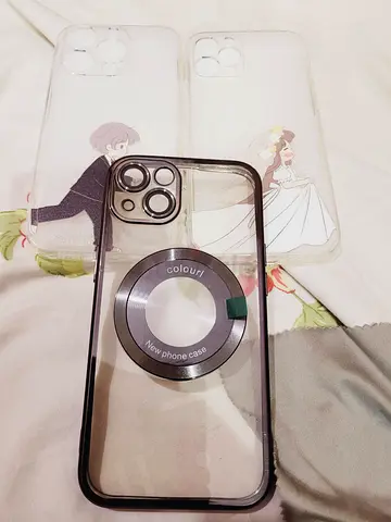 Three clear iPhone cases (one with metal ring holder) - good condition