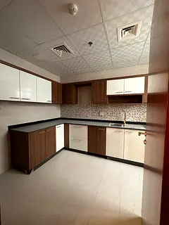 Two bedrooms, a living room, two bathrooms, central AC, built-in wardrobes, and FREE PARKING
