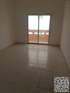 A spacious apartment is available for annual rent in Al Rumailah, Ajman, featuring a convenient loca