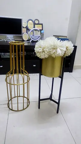 Set of 2 metal plant/side stands — black console and gold round cage stand