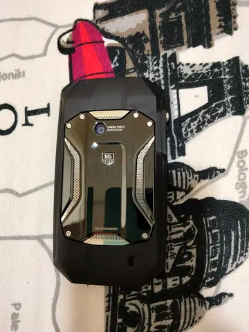 Tag Heuer phone with metal back — used, good condition