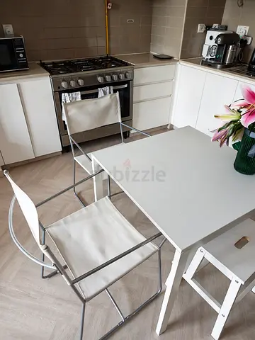 Ikea white dining table with two metal canvas chairs — good condition.Table dimensions 75 cm x 75 cm