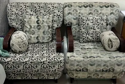 Pair of patterned upholstered armchairs with cushions - good condition