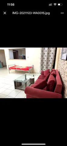 Maroon 3-seater and 2 seater sofa with matching cushions - good condition