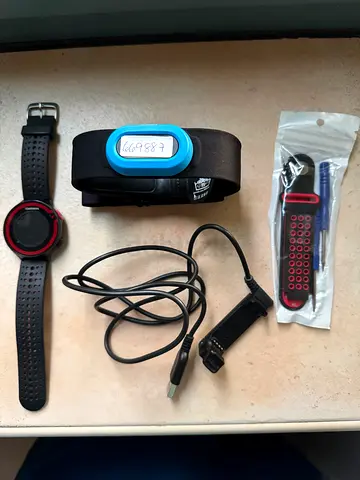 Garmin forerunner 220 with Heart rate chest strap, USB charger and spare strap.