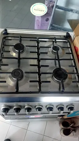 Used 4-Burner Stainless Steel Gas Stove with Oven - Good Working Condition