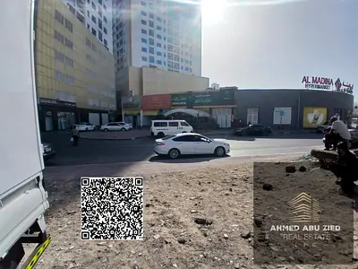 ارض سكني تجاري (G+8) زاويه شارع وسكه مقابل ابراج اللؤلؤه في الراشيديه عجمان