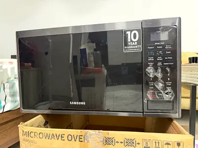 Samsung countertop microwave oven - 10 year warranty with almost new condition