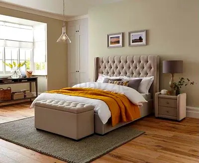 Beige tufted upholstered double bed with storage bench