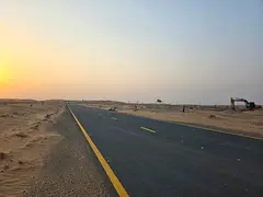 Residential land for sale in Rawdat Al Qurt, Al Ruwaidat suburb, Sharjah.