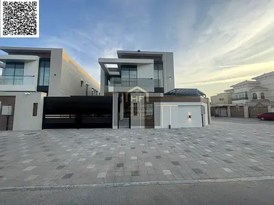 Villa for sale in Al Rawda area, with electricity and water included, featuring distinctive modern finishing and decor.