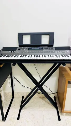 Yamaha portable keyboard with stand - good working condition Very rarely used..like New.. with stand