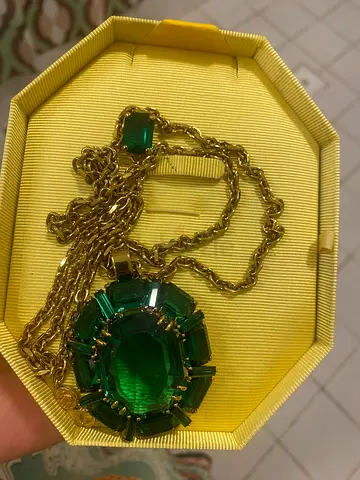 Gold-tone long Swarovski chain necklace with large green gemstone pendant
