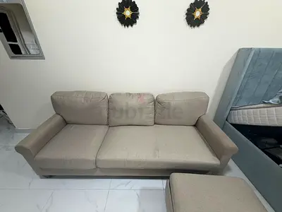 3-seater sofa with a matching tea table available for sale. In excellent condition, clean and well