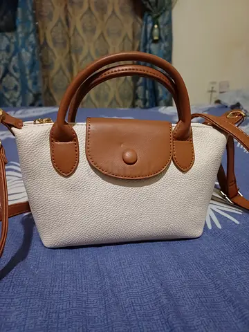 Small white and tan shoulder handbag with detachable strap
