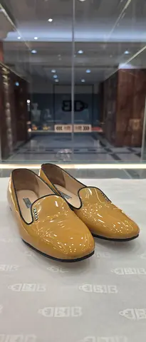 Pair of women's beige patent leather loafers - like new