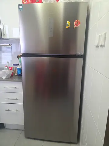 Used stainless steel top-freezer refrigerator - good condition