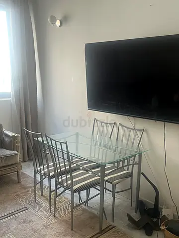 Glass Top Dining Table with 4 Metal Chairs - Modern Design