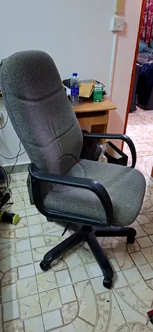 Gray fabric office chair with armrests and lumbar support