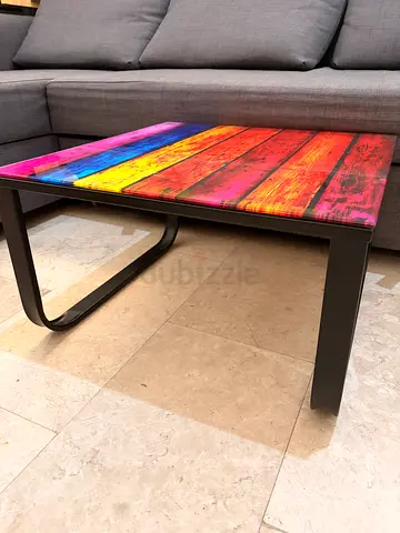 Small glass modern side table with colorful wood-effect top