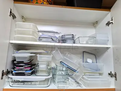 Mixed set of glass and plastic food storage containers with lids