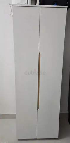 Tall white two-door storage cabinet / wardrobe - very good condition