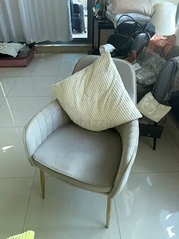 Light grey upholstered accent chair with gold legs - average condition